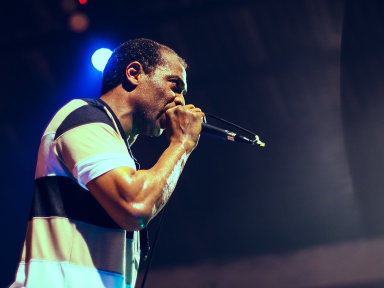 Femi Kuti, holding mic